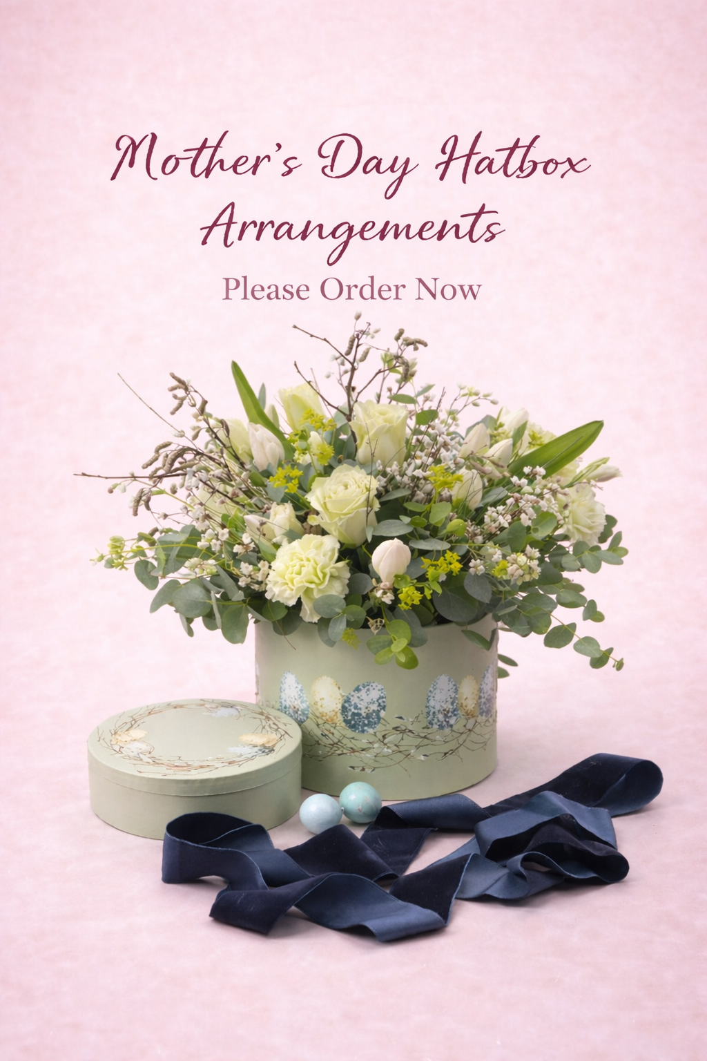 Hat box arrangement with seasonal blooms (free delivery to BT38 and BT40)